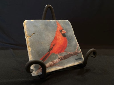 Red trivet on an iron stand