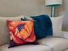 Wideshot of Brilliant Bloom decorative pillow on a couch