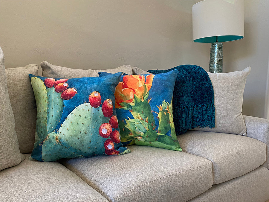 The Fruit of the Opuntia and Ahead of Its Time decorative pillow on a couch