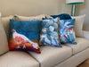 The Follow the Leader, Stick With Me, and All in The Family decorative pillows on a couch