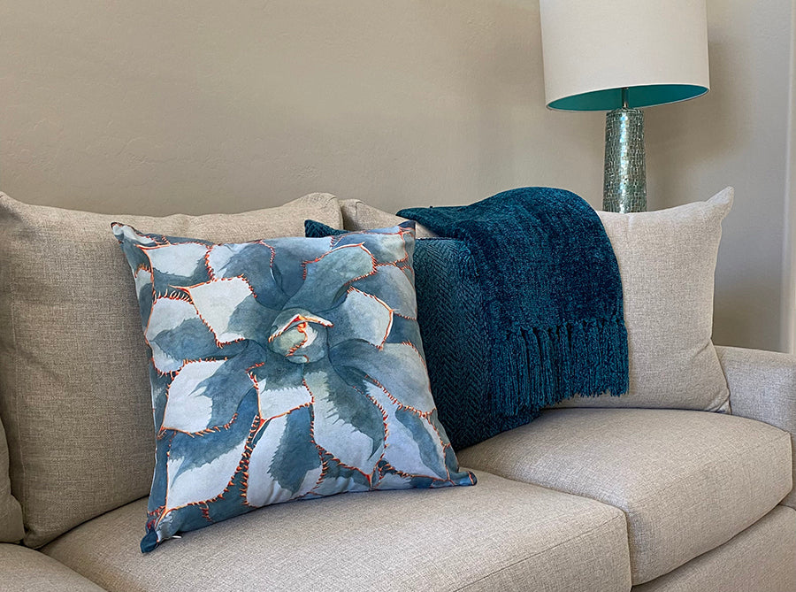 Wideshot of Stick With Me decorative pillow on a couch